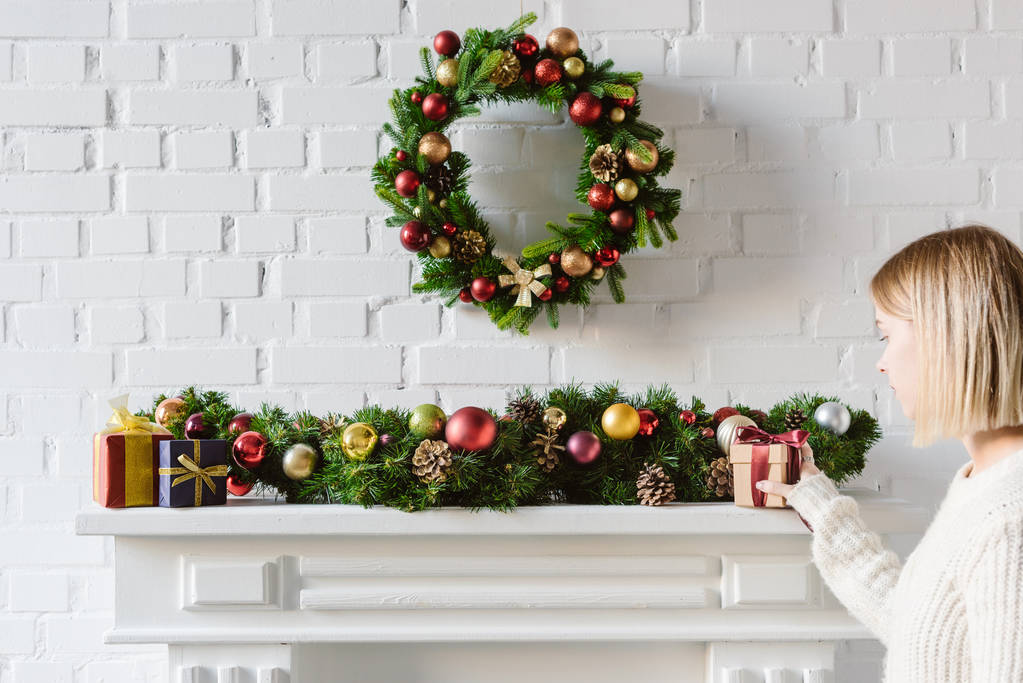 stock-photo-christmas-wreath-decorations-fireplace-mantel.jpg